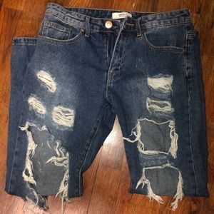 super ripped/ distressed dark wash jeans